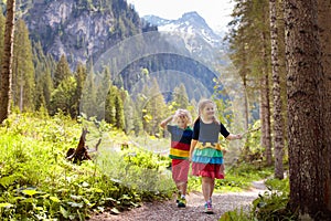 Children hiking in the Alps mountains