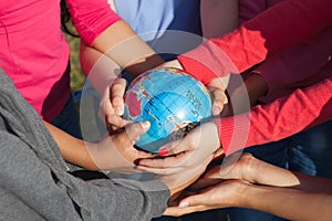 Children hold globus photo