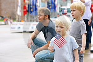 Children Holding American Flags at Patriotics Parade Event