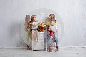 Children holding a basket of fresh fruit and vegetables healthy food
