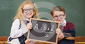 Children holding blackboard with math equation