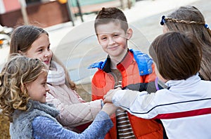 Children holding hands and giving friendship vow