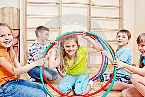 Children holding hula hoops photo