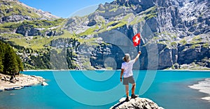 children holding Switzerland flag