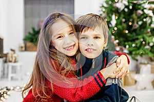 Children are hugging. The boy and the girl. Happy Christmas and