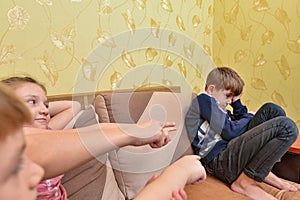 Children humiliate the boy and poke a finger at him in protest of communication