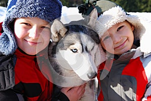 Children and husky dog