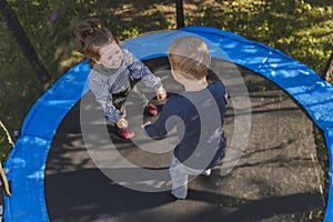 children jump on the trampoline