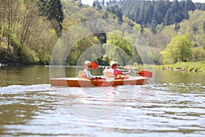 Children kayaking on the river