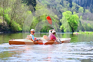 Children kayaking on the river