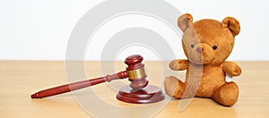 Children, Kid and Family Law concepts. toy bear with gavel justice hammer on desk in courthouse