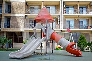 Children kids playground with play equipment outdoor. Kids playground with slides in the park. play ground red and white big