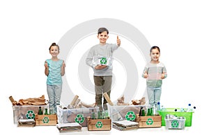 children l sorting paper, metal and plastic waste