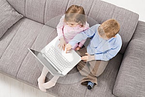 Children with laptop computer