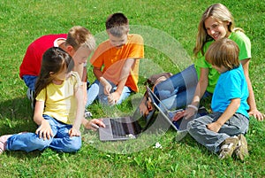 Children with laptop computers