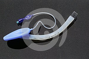 Children Laryngeal mask airway for emergency medical help on a black background.