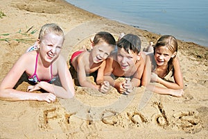 Children laying on the beach