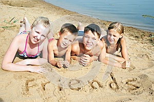 Children laying on the beach