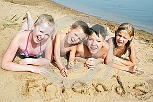 Children laying on the beach
