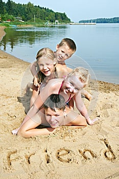 Children laying on the beach