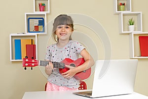 Children learn music lessons online at home. Homeschooling and distance education for kids.