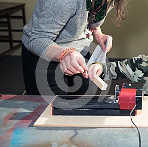 Children learn to make custom objects in fablab classes. Joiner`s training on makerfaire.