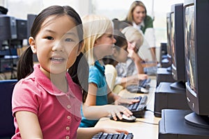 Children learning how to use computers.