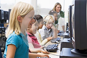 Children learning how to use computers.