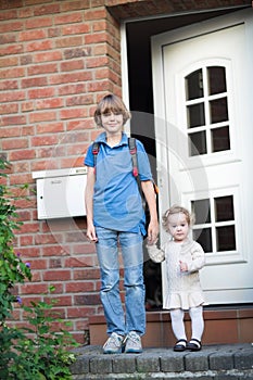 Children leaving home on first day to school