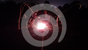 Children lighting firecrackers at night, Dipawali festival celebration