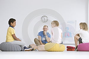 Children listening to paramedic