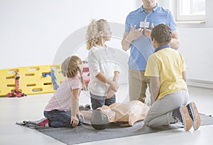 Children listening to paramedic