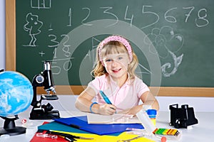 Children little girl at school with microscope