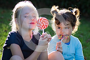 Children with lollipop candy