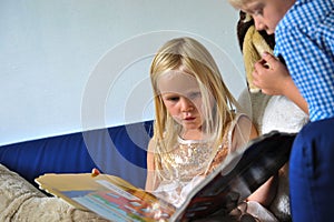 Children looking in book