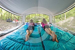 Children Looking Out Windows of Pop-Up Camper 180 Degrees