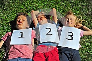Children luying on the grass
