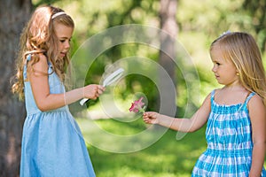 Children with a magnifying glass