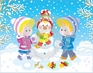 Children making a Christmas snowman