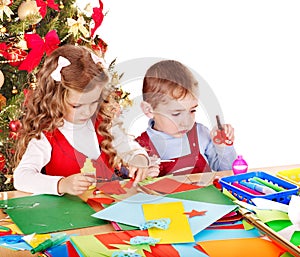 Children making decoration for Christmas.