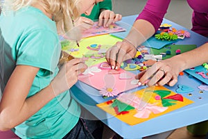 Children making decorations on paper