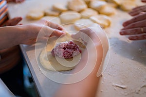 Children making traditional Russian pirozhky