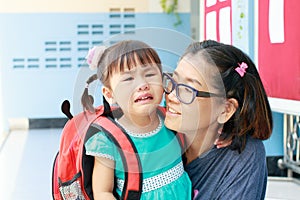 Children and mother crying first day go to pre-kindergarten scho