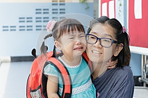 Children and mother crying first day go to pre-kindergarten scho