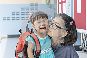 children and mother crying first day go to pre-kindergarten school