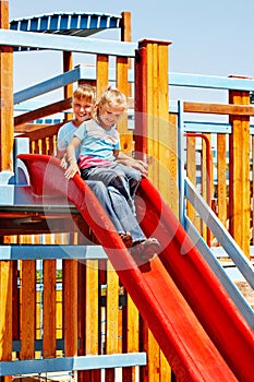 Children move out to slide in playground