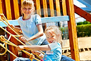 Children move out to slide in playground