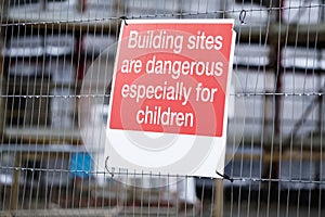 Children must not play on scaffolding at construction building site safety sign