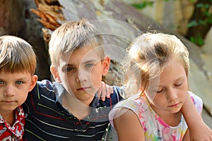 Children are near the ruined house, the concept of natural disaster, fire, and devastation.