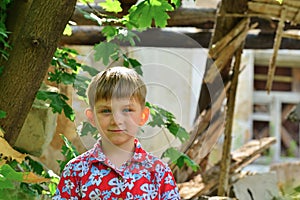 Children are near the ruined house, the concept of natural disaster, fire, and devastation.